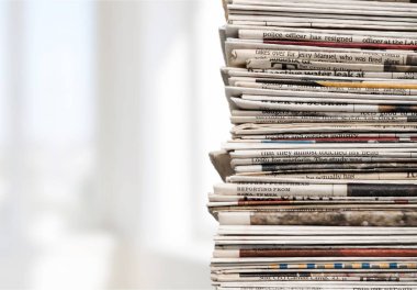 Pile of newspapers on background, close-up view  clipart
