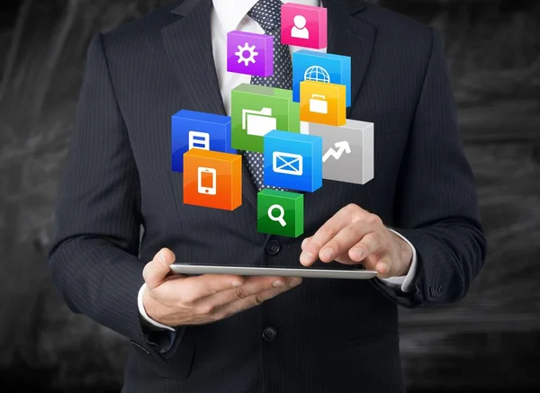 Businessman Holding Tablet Digital Icons Background — Stock Photo, Image