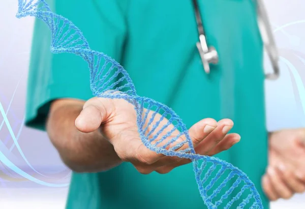 close-up view of dna symbol in hand of doctor