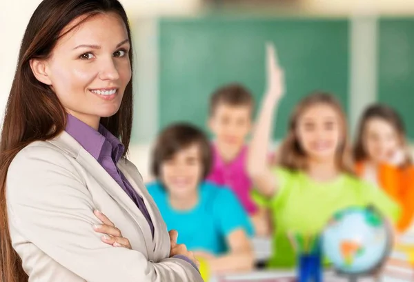 Kvinnlig Lärare Med Barn Klass Bakgrund — Stockfoto