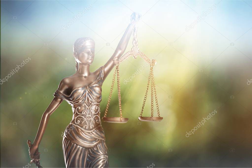 Themi symbol of justice, blurred background 