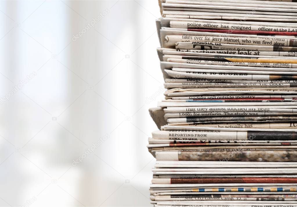 Pile of newspapers on background, close-up view 