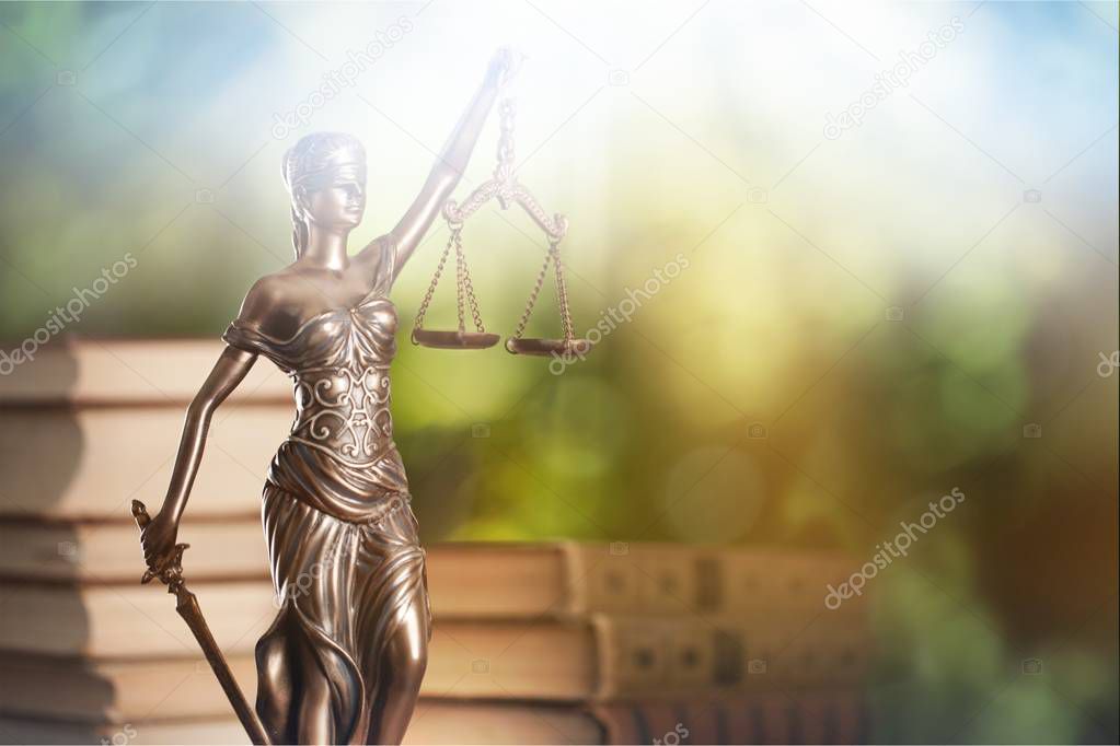 Themi symbol of justice, blurred background 