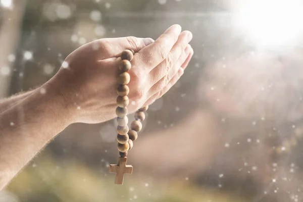 Hands of human praying, close-up view