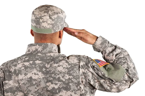Soldat i uniformshilsen, sett bakfra – stockfoto
