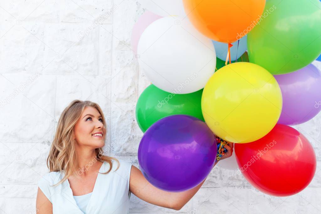 woman with colorful air balloons