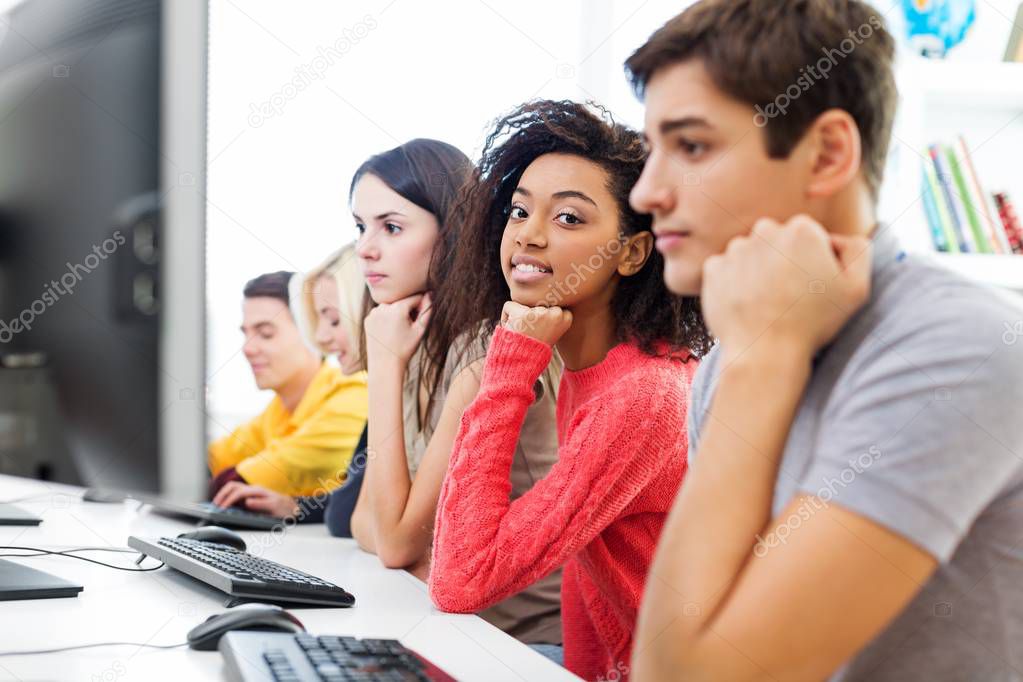 Group of Students in class working by computer