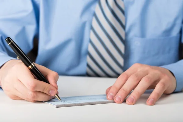 Businessman Writing a Cheque — Stock Photo, Image