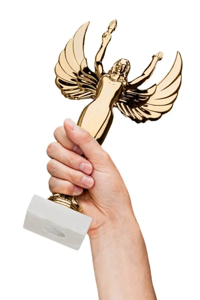 Mão segurando um troféu de ouro — Fotografia de Stock