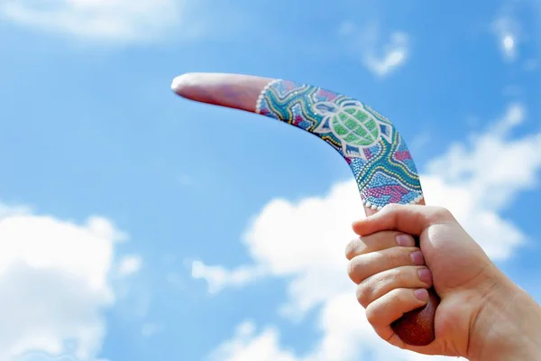 Wooden Boomerang with Blue Sky and Cloud Background — Stock Photo, Image