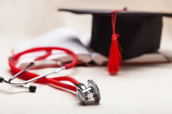 Stethoscope and graduate hat medical education graduate achievement adult background