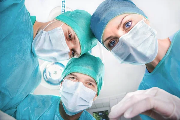 Closeup of Doctors and Nurses in an Operating Room