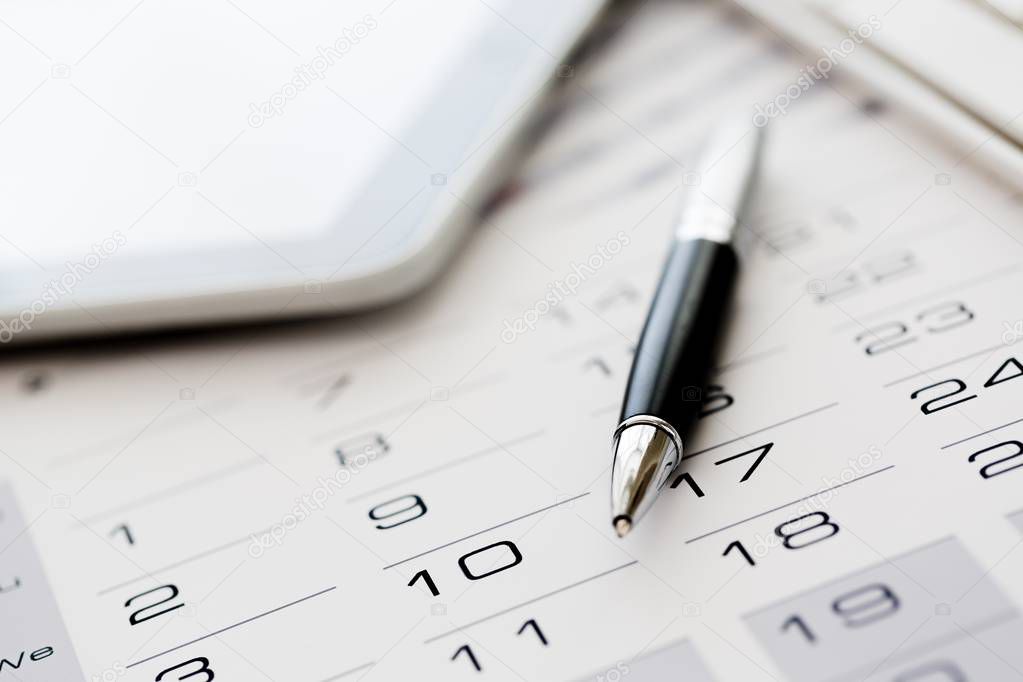 business calendar and pen on the table