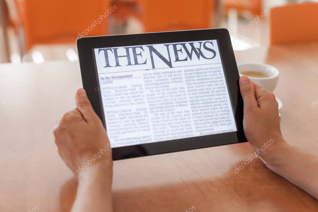 Reading News on Tablet