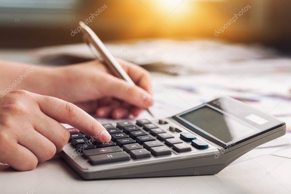 Woman with calculator.