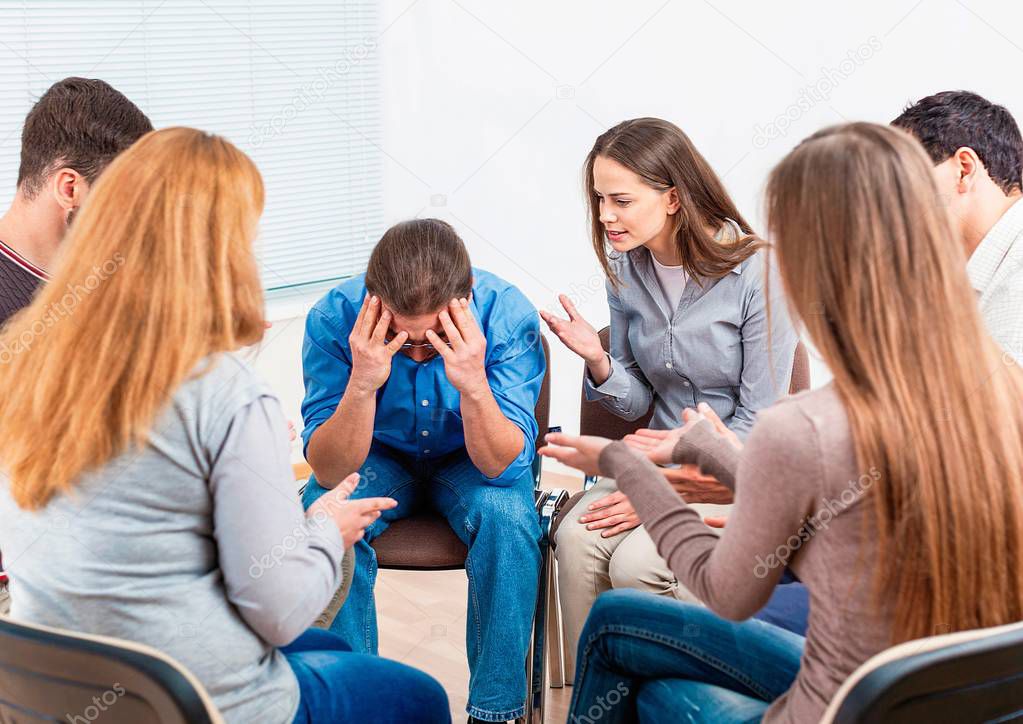 Group of people counseling with psychotherapist 