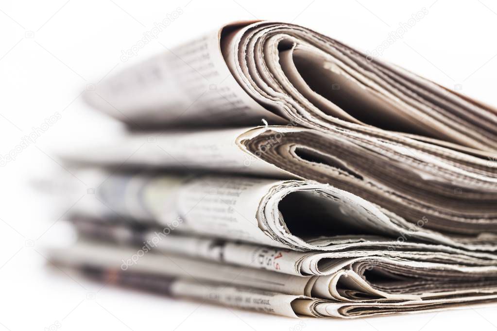 Pile of newspapers on background, close-up view