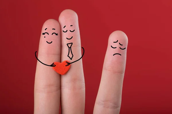 Happy fingers in love with painted smiley and a sad finger Royalty Free Stock Photos