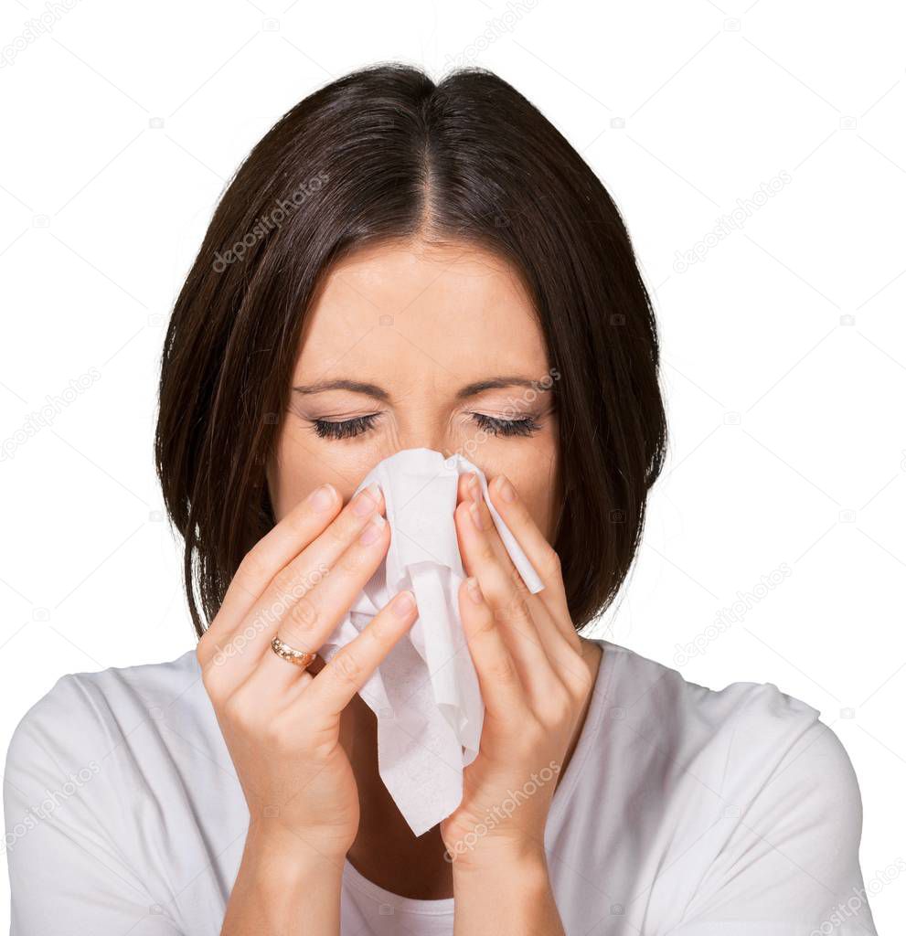 Sick Young Woman Blowing Nose
