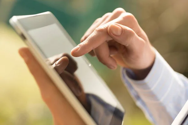 Person holding a tablet computer