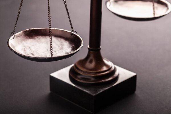Law scales justics scale weighing old lawyer litigation
