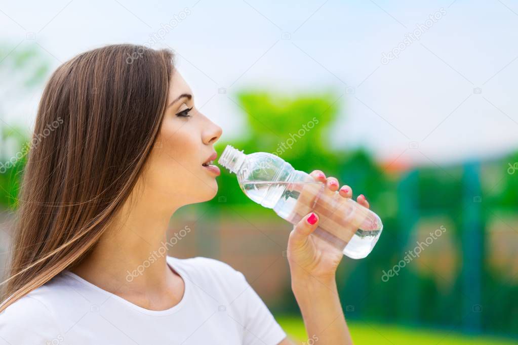 Portrait of a Woman Drinking Water