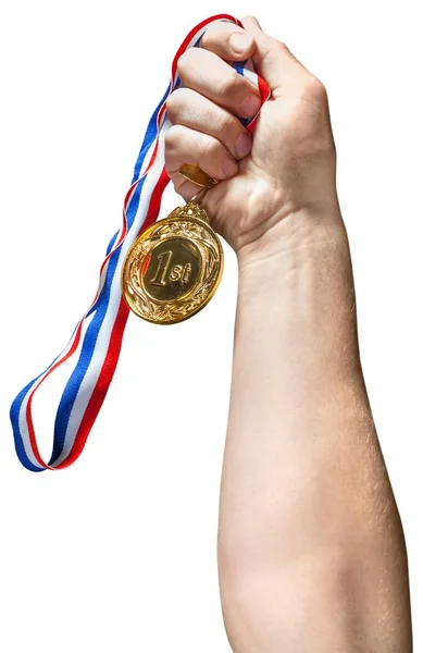 Mão segurando uma medalha de ouro — Fotografia de Stock