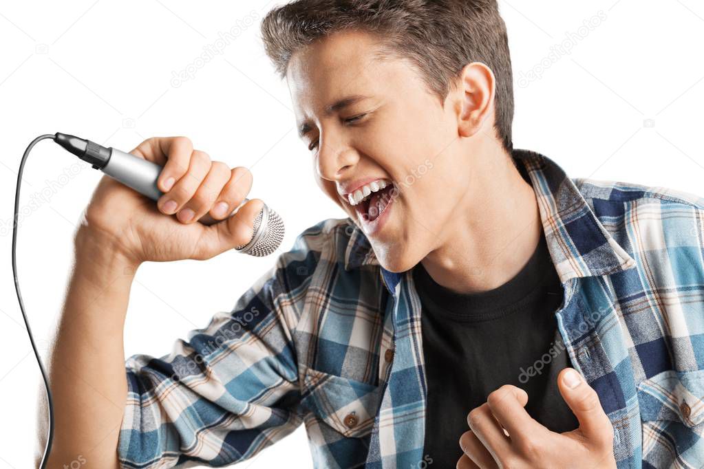 young man singing in microphone isolated on white background