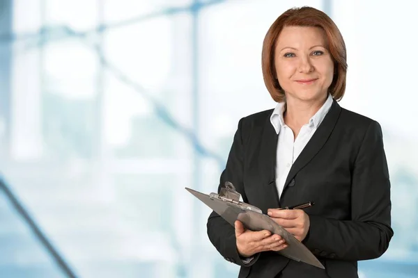 Smiling Businesswoman Holding Clipboard — Stock Photo, Image