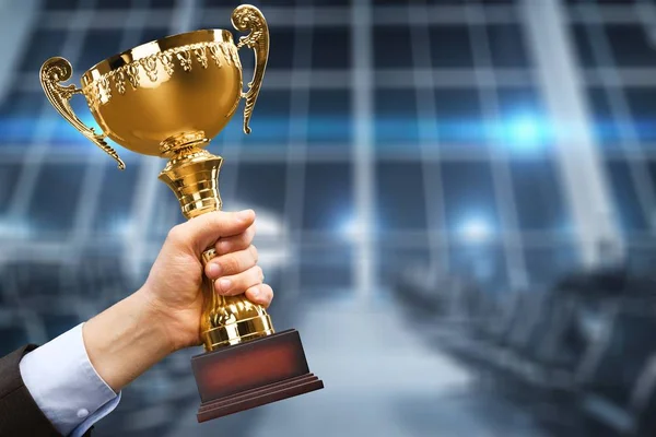 Hand Holding Golden Trophy Blurred Background — Stock Photo, Image