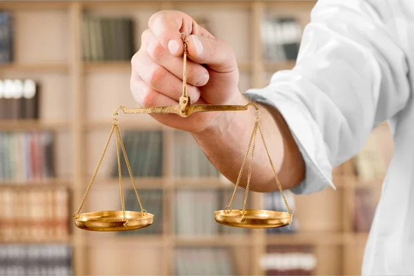 Justice Scales in hand — Stock Photo, Image