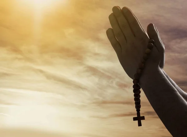 Hands of human praying, close-up view