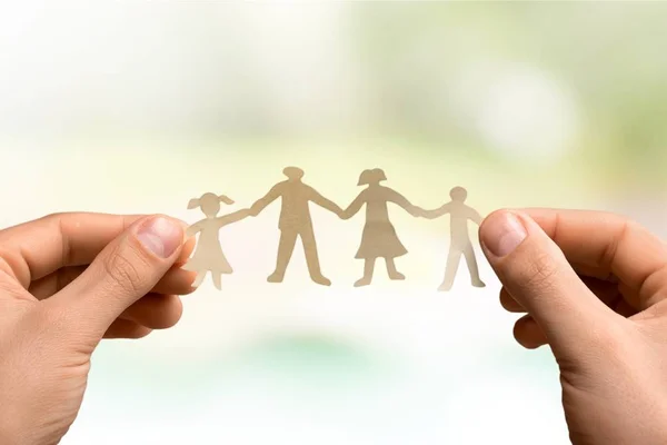 Love and relationships concept, paper family in hands