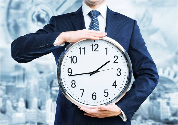 Portrait Young Business Man Holding Clock Blurred Background — Stock Photo, Image