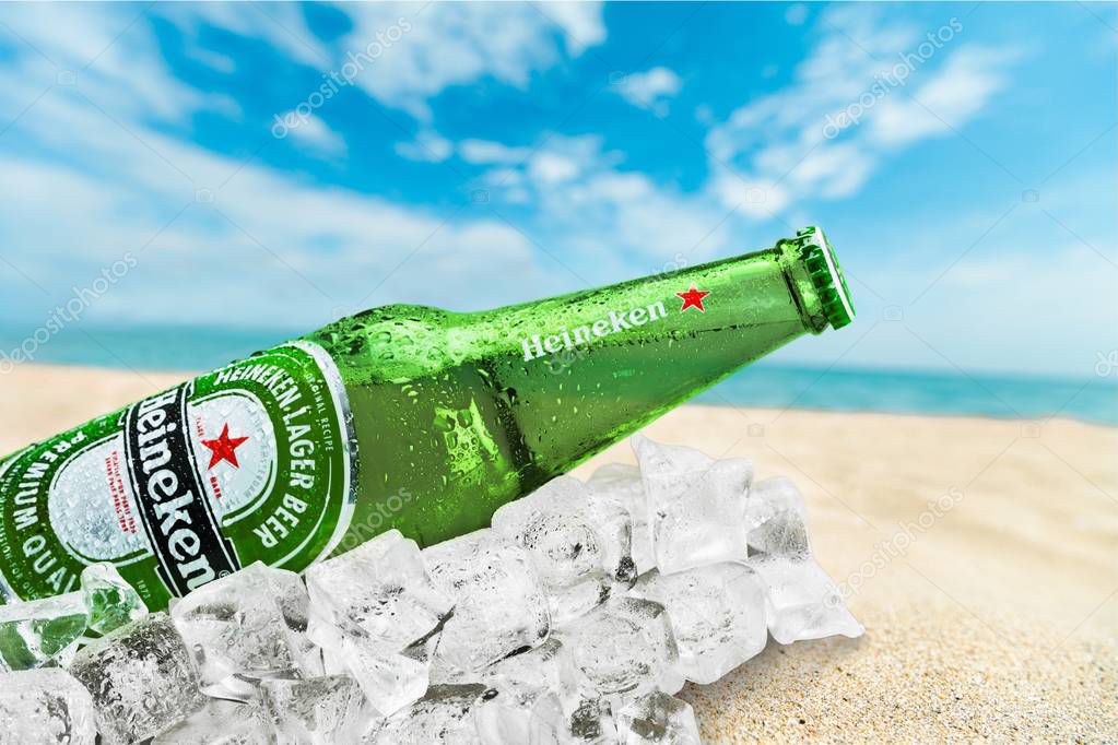 KHERSON, UKRAINE - NOVEMBER 11, 2014: Heineken Beer on beach background