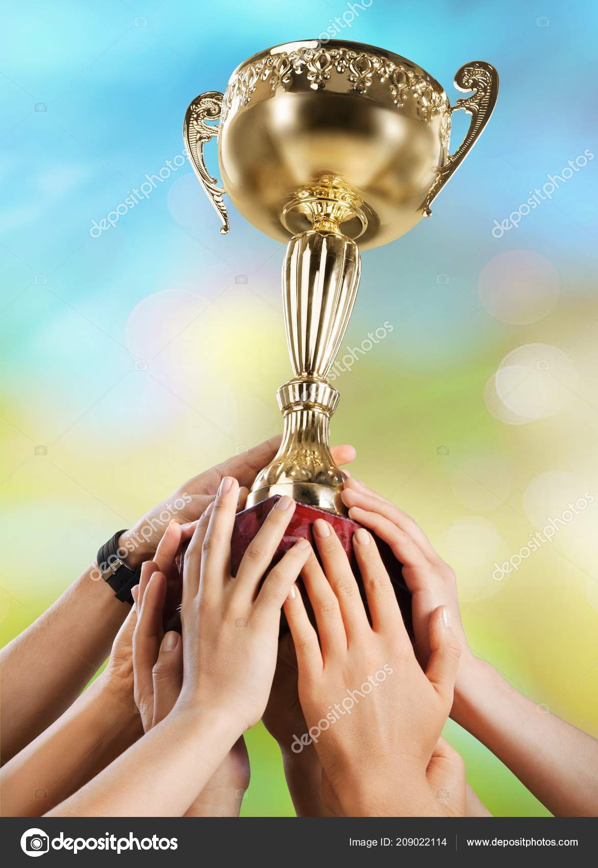 Hands Holding Golden Trophy Background Stock Photo by ©billiondigital