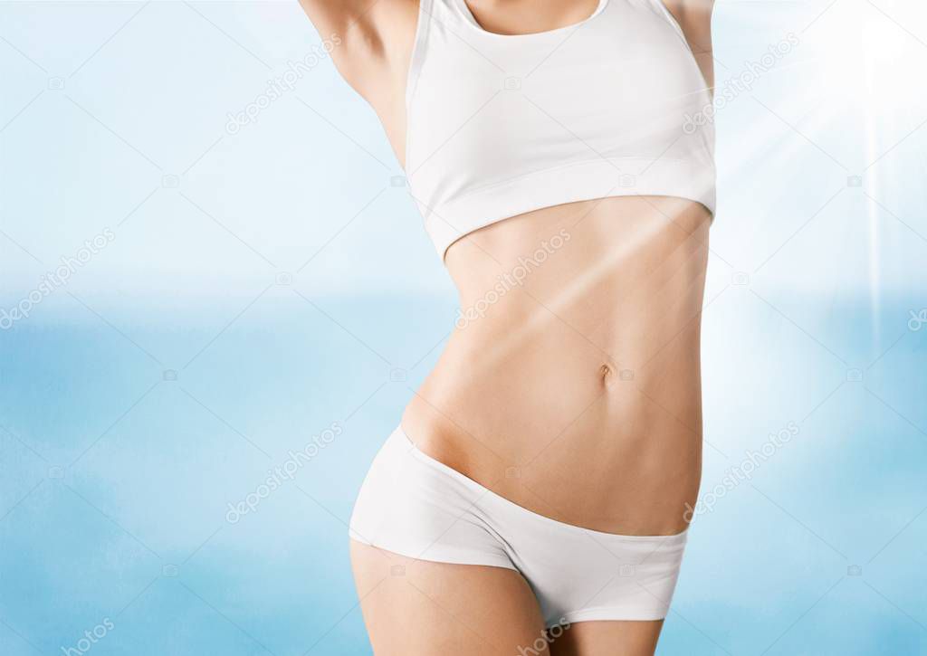 young woman showing waist 