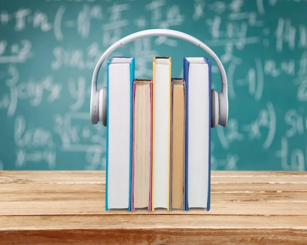 Stack Books Headphones Wooden Table — Stock Photo, Image