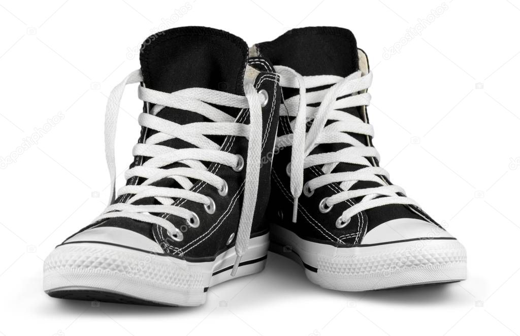 Pair of new black sneakers isolated on white 