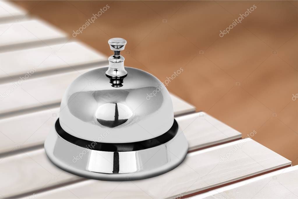 Reception service desk bell on blurred background 