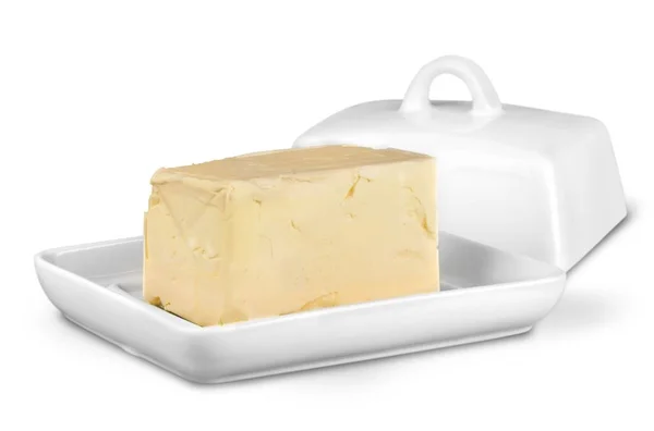 Manteiga de bloco inteiro na placa branca — Fotografia de Stock