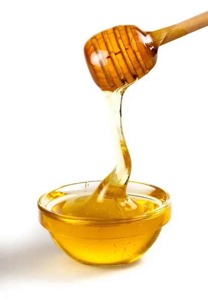 Miere picurând din dipper de miere — Fotografie, imagine de stoc
