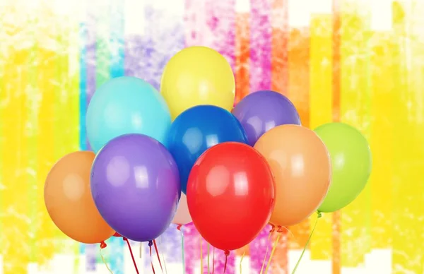 Bunch of colorful balloons on background