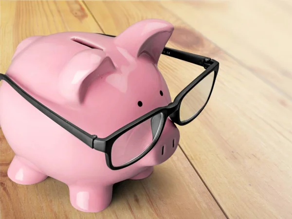 Piggy Bank Glasses Isolated Wooden Background — Stock Photo, Image