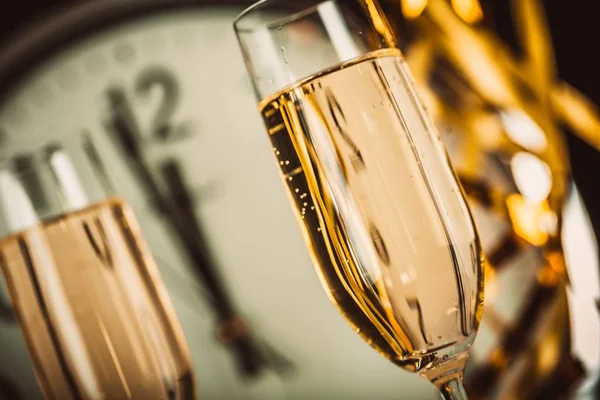 Flute glasses of champagne on white background