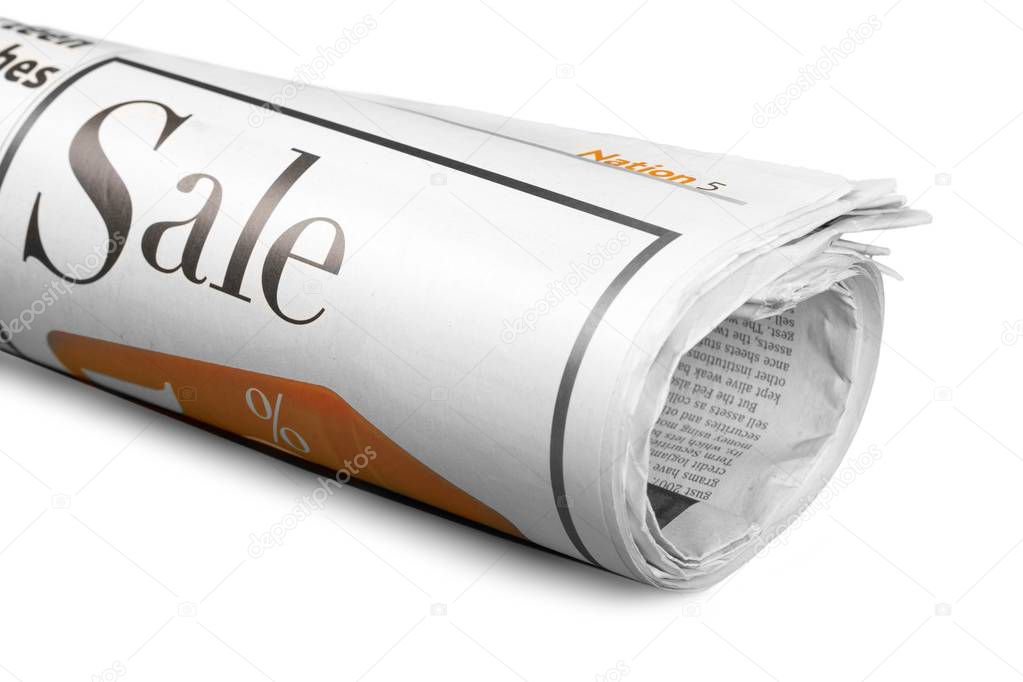 Rolled Newspaper with Sale Word