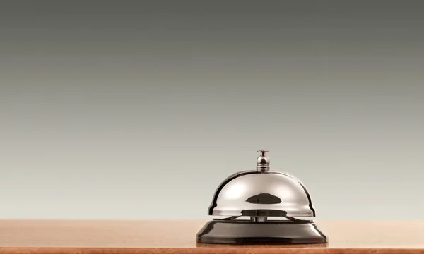 Reception service desk bell on blurred background