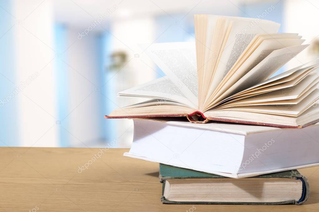  stack of books on wooden table