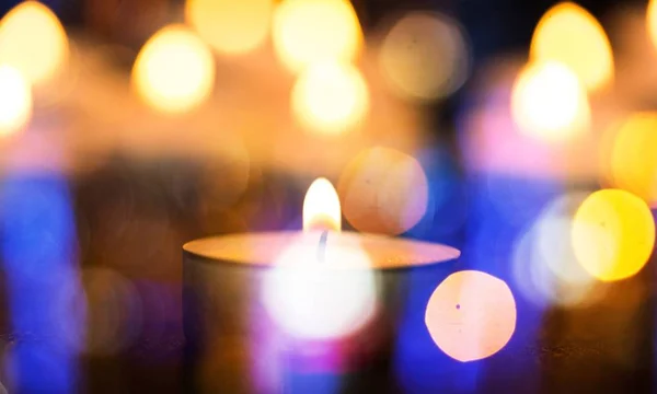 Christmas candle burning at night — Stock Photo, Image