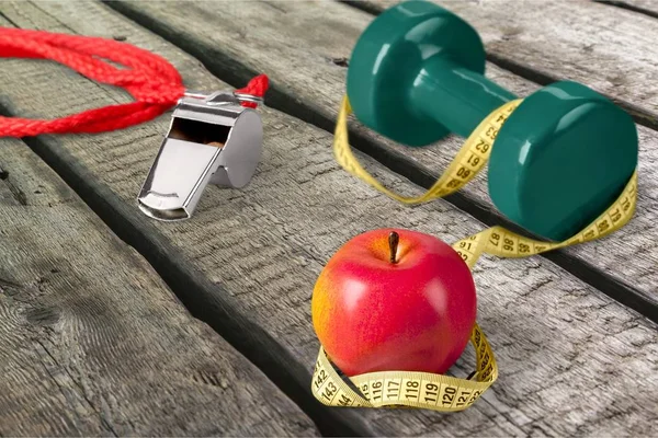 Dieting healthy eating weight exercising apple healthy lifestyle dumbbell